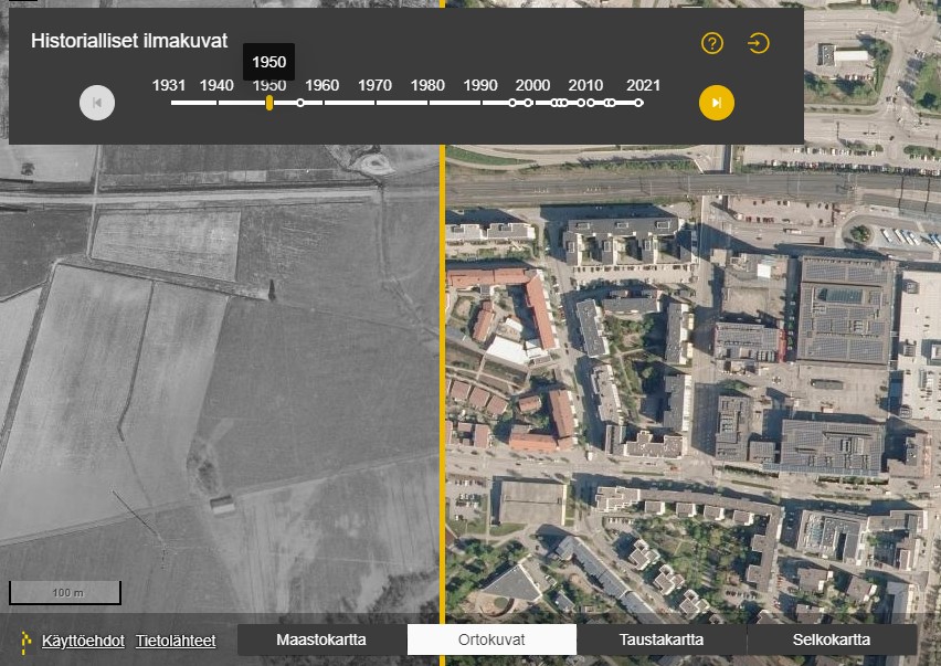 Vertailukuva vanhasta ja uudesta ilmakuvasta paikkatietoikkunassa. Vanhassa kuvassa näkyy peltoja, uudessa rakennuksia.