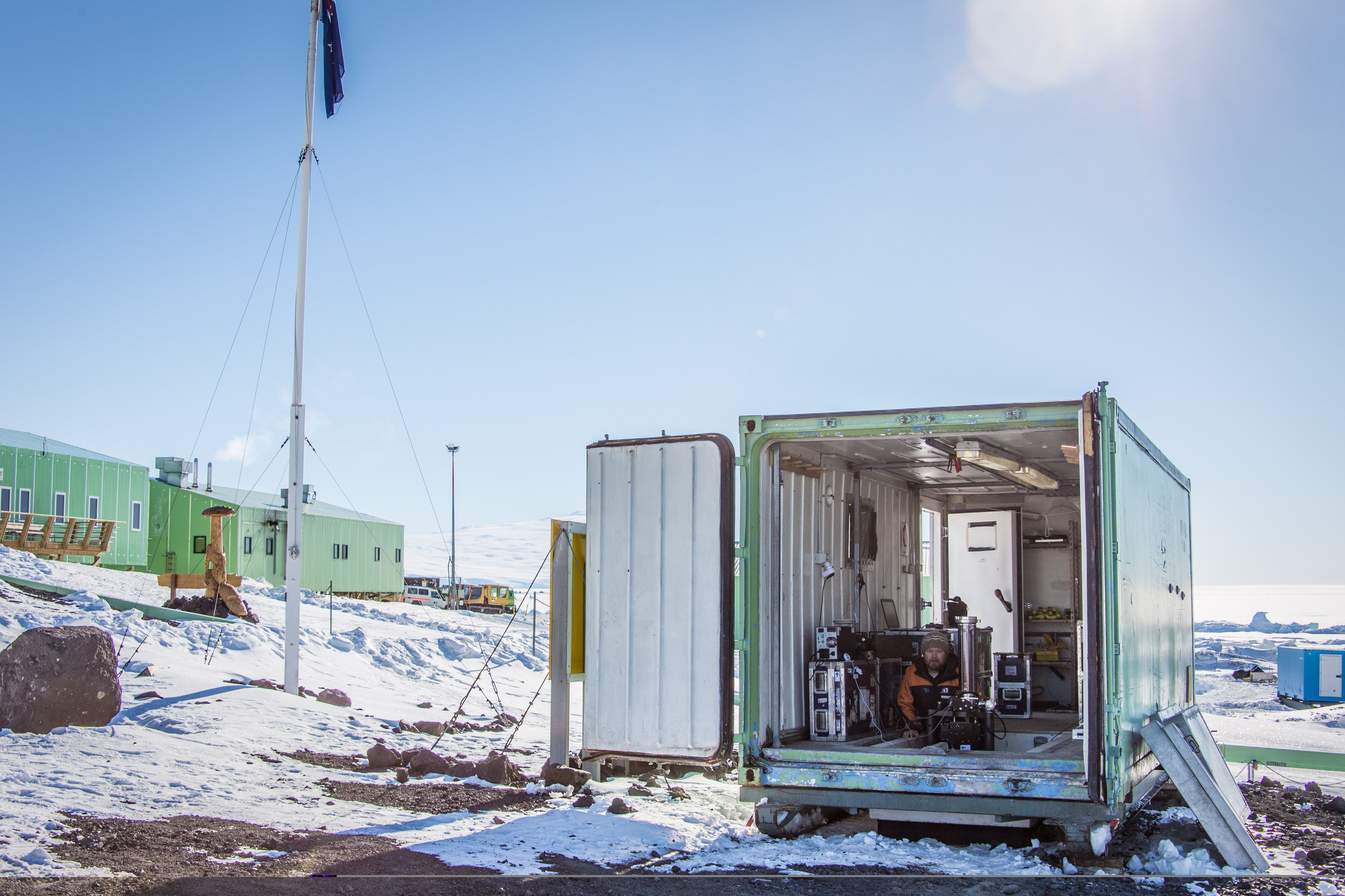 Jyri Näränen in a diving hut measuring gravity.