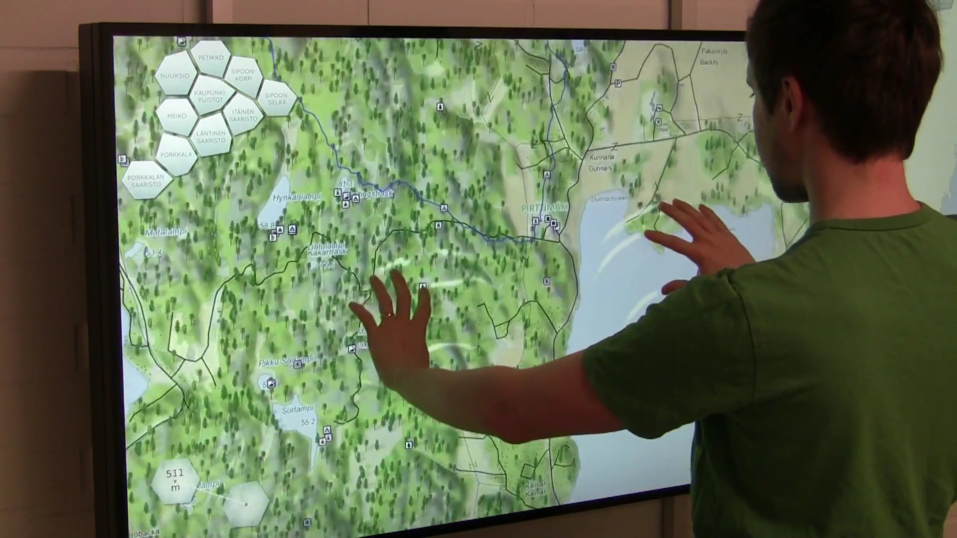 A person wieving a touch screen map.