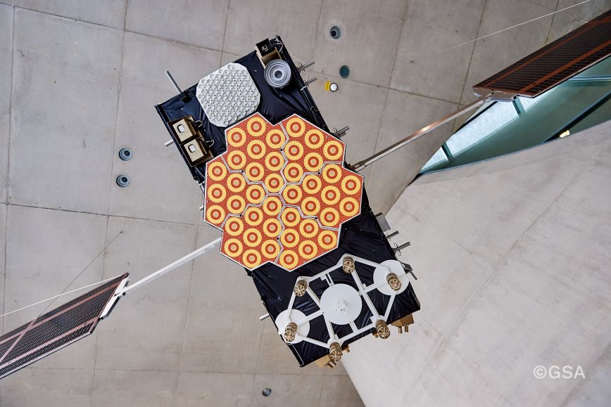 Model of Galileo satellite hangs from concrete ceiling