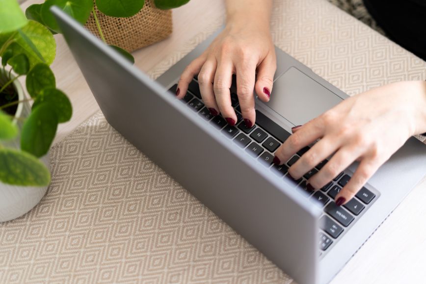 Person typing on a computer.