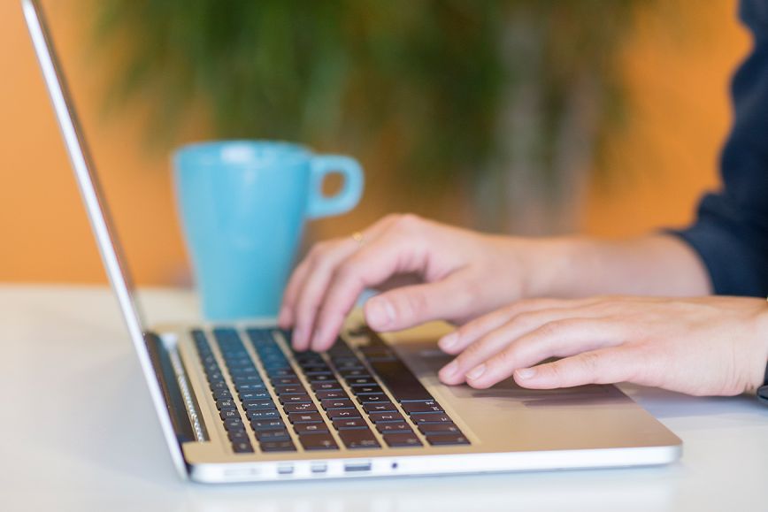 A person in front of a laptop.