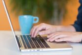 A person in front of a laptop.