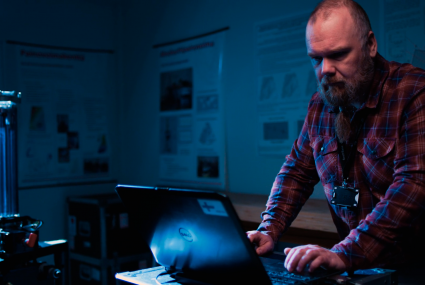 Researcher using an absolute gravimeter
